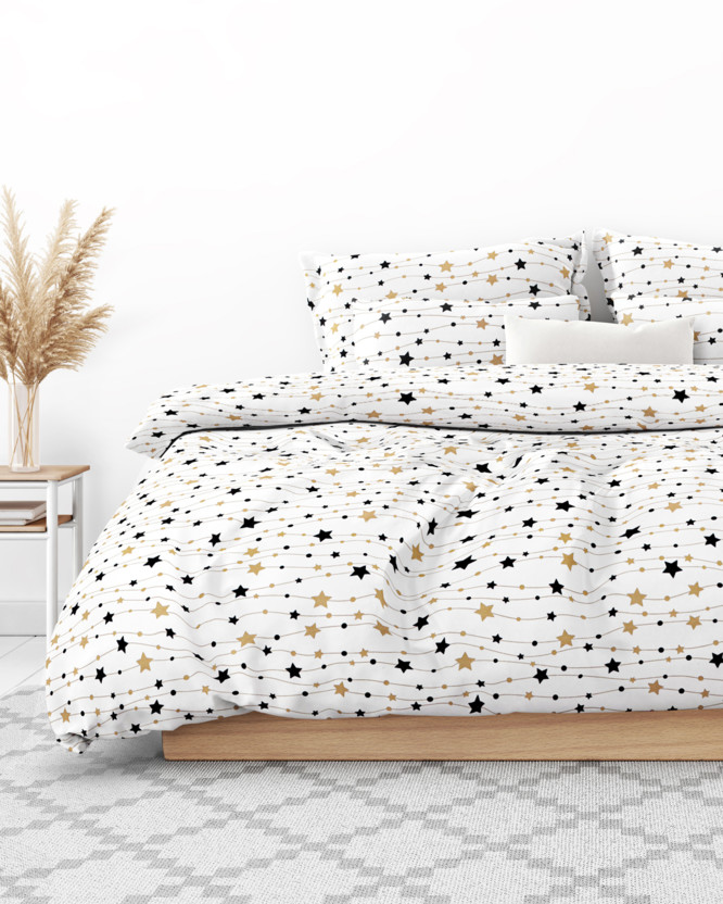 Lenjerie de pat flanel - model de Crăciun - steluțe aurii și negre pe alb